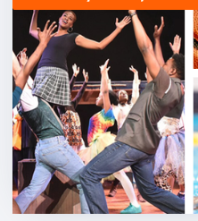 Young performers dancing on stage with arms raised