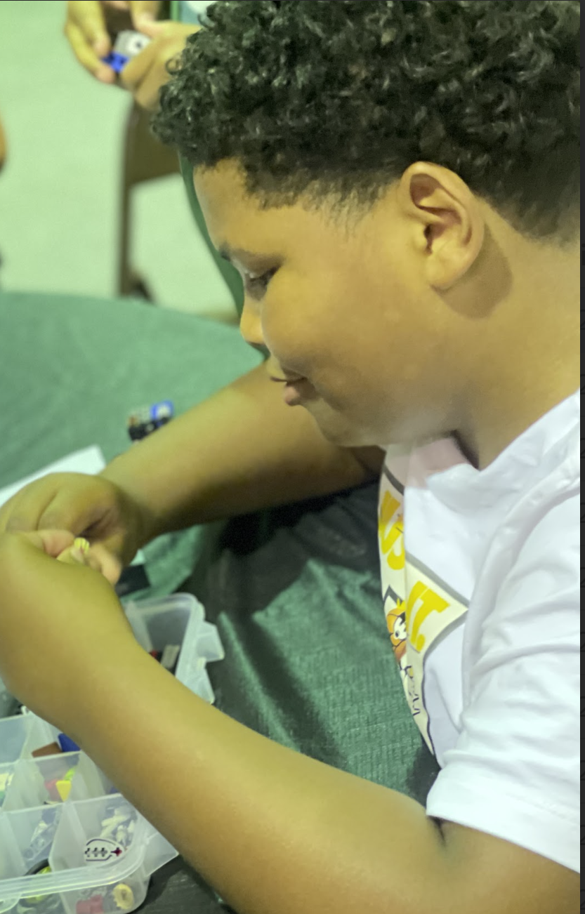Campers making bead jewelry